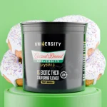 Glazed Donut THCA Premium Exotic Flower 1G in black jar with donut design background